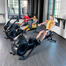 Load image into Gallery viewer, Row of TRUE Rō commercial rowing machines in a functional training area